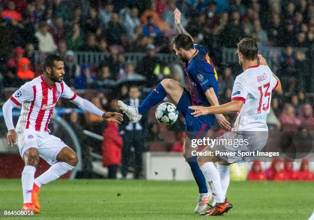 Lionel Andres Messi of FC Barcelona is tackled by with Guillaume Gillet of Olympiacos FC during the UEFA Champions League 2017-18 match between FC...