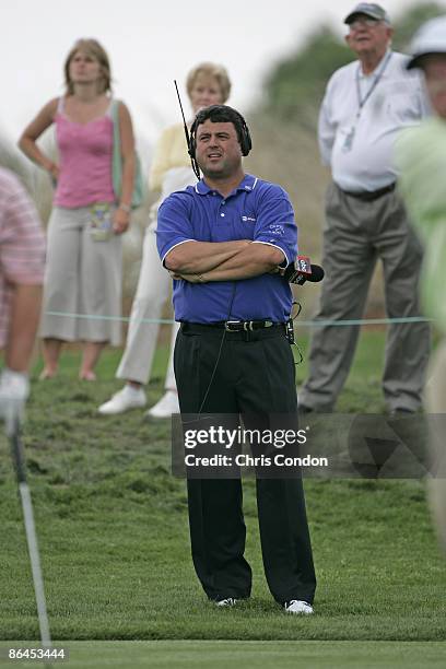 Billy Ray Brown of ABC Sports watches the action in the second round of the Liberty Mutual Legends of Golf at Westin Savannah Harbor Golf Resort &...