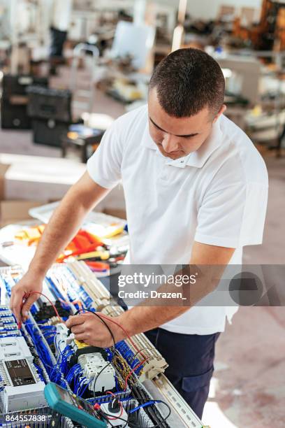 new machine part and fuse box connection process - electrical fuse box stock pictures, royalty-free photos & images