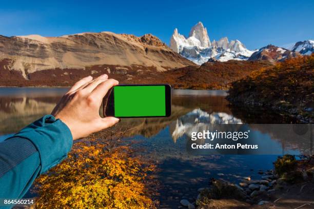 green screen handheld smartphone in patagonia - the catalyst santa cruz stock pictures, royalty-free photos & images