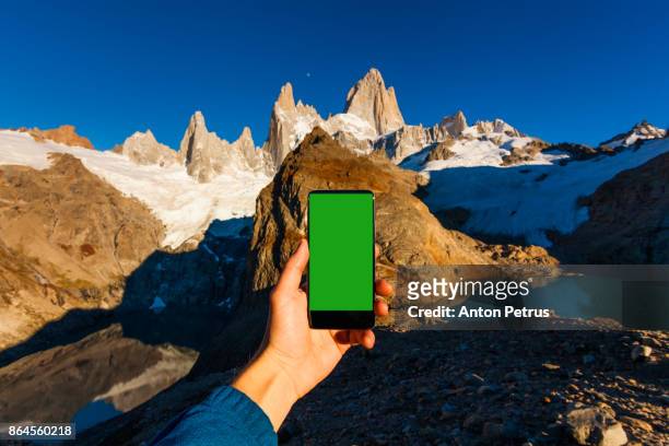 green screen handheld smartphone in patagonia - the catalyst santa cruz stock pictures, royalty-free photos & images