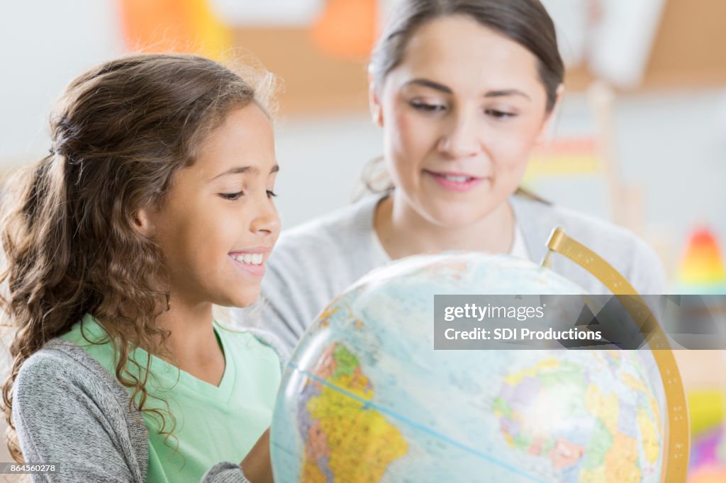 Curious elementary student learns geography