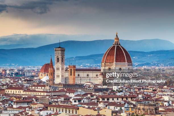 the view from piazzale michelangelo over to the historic city of florence at dusk. - florencia fotografías e imágenes de stock