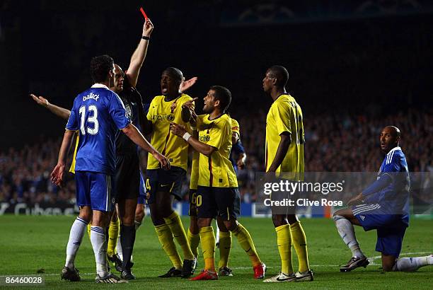 Samuel Eto'o of Barcelona and his team mates argues with referee Tom Henning Ovrebo after Eric Abidal of Barcelona received a red card during the...