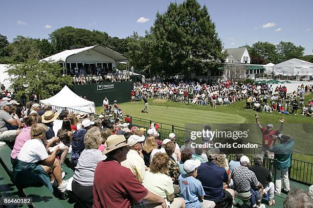 Spectators gather at the first tee during the third round of the Travelers Championship held at TPC River Highlands in Cromwell, Connecticut, on June...
