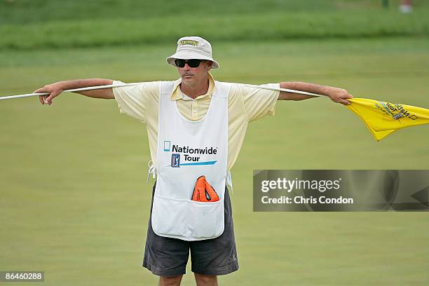 Caddie holds the flag on during the third round of the Cox Classic Presented by Chevrolet held at Champions Run in Omaha, Nebraska, on July 28, 2007.