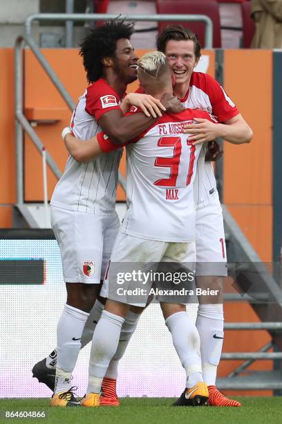 Michael Gregoritsch of Augsburg ist celebrated by his team mates after he scored a goal to make it 1:0 for Augsburg, during the Bundesliga match...