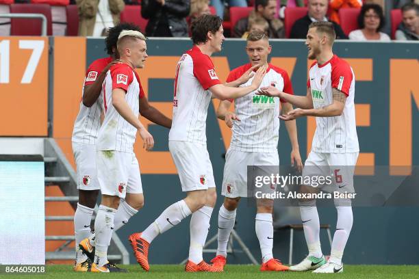 Michael Gregoritsch of Augsburg ist celebrated by his team mates after he scored a goal to make it 1:0 for Augsburg, during the Bundesliga match...