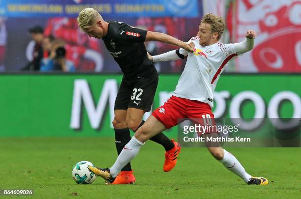 Emil Forsberg of Leipzig battles for the ball with Andreas Beck of Stuttgart during the Bundesliga match between RB Leipzig and VfB Stuttgart at Red...