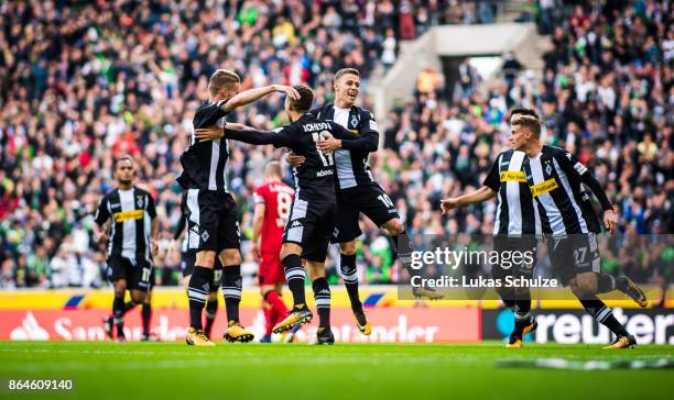 Players of Moenchengladbach celebrate their teams first goal during the Bundesliga match between Borussia Moenchengladbach and Bayer 04 Leverkusen at...