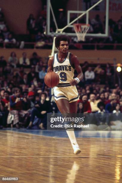 Randy Smith of the Buffalo Braves moves the ball up court against the Boston Celtics during a game played in 1974 at the Boston Garden in Boston,...