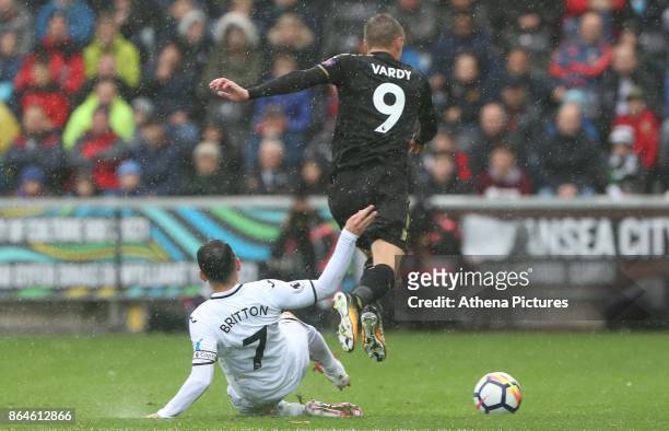 Leon Britton of Swansea City tackles Jamie Vardy of Leicester City during the Premier League match between Swansea City and Leicester City at The...