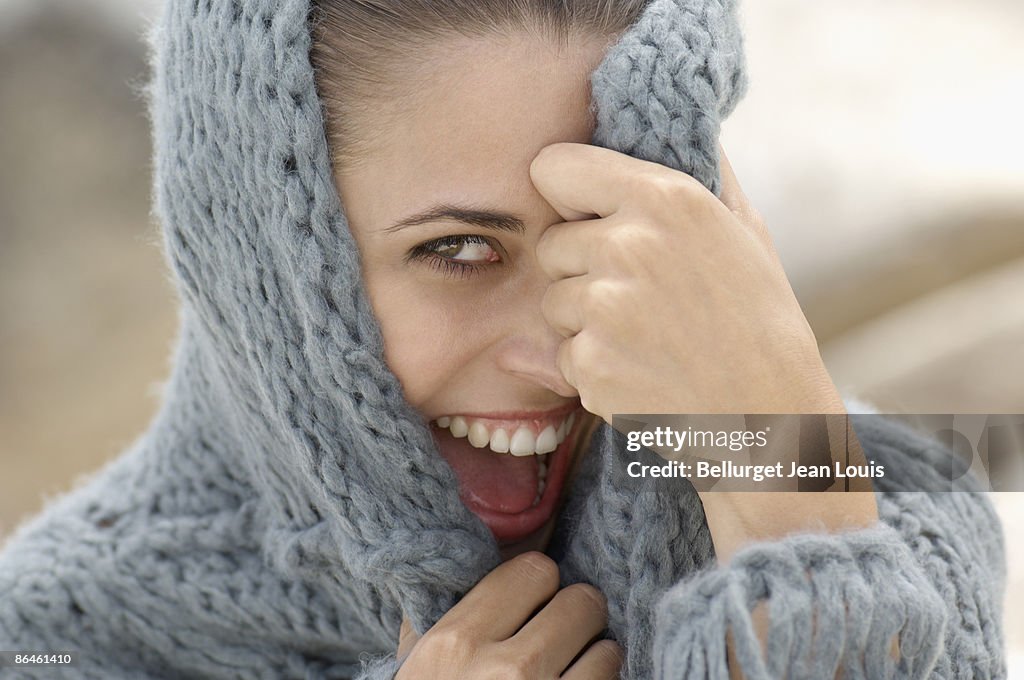 Smiling woman in hooded sweater