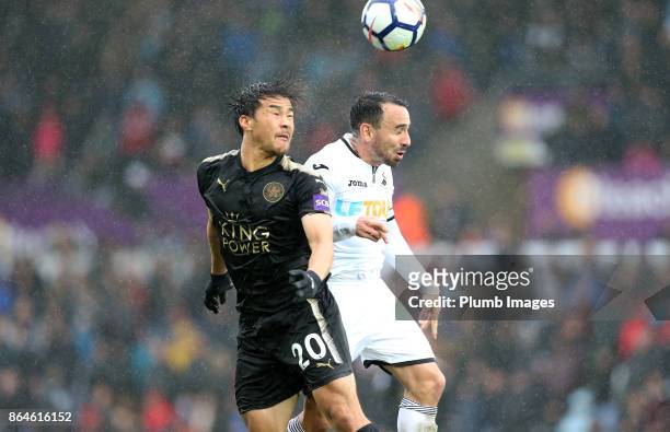 Shinji Okazaki of Leicester City in action with Leon Britton of Swansea City during the Premier League match between Swansea City and Leicester City...