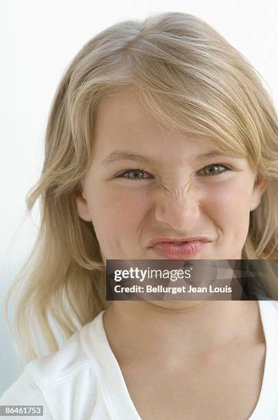 girl making silly facial expression - facial expression (disgust) photos et images de collection
