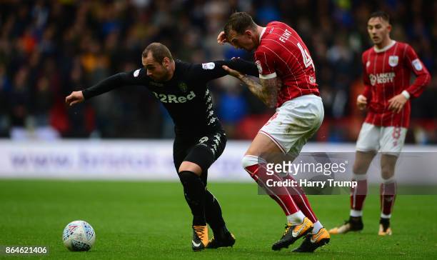 Pierre-Michel Lasogga of Leeds United is tackled by Aden Flint of Bristol City during the Sky Bet Championship match between Bristol City and Leeds...