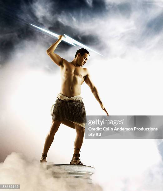 zeus holding lightning bolt - men in loincloths stock pictures, royalty-free photos & images