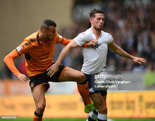 Wolverhampton Wanderers' Romain Saiss vies for possession with Preston North End's Alan Browne during the Sky Bet Championship match between...