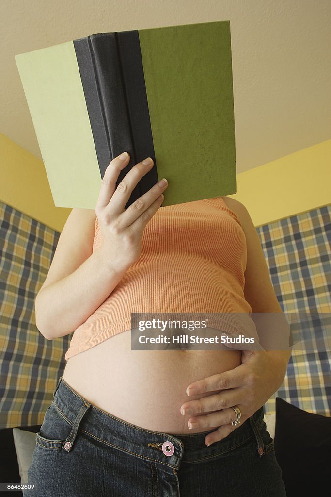 Pregnant woman reading book