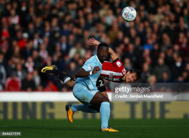 Lasse Vibe of Brentford and Lamine Kone of Sunderland challenge for the ball during the Sky Bet Championship match between Brentford and Sunderland...