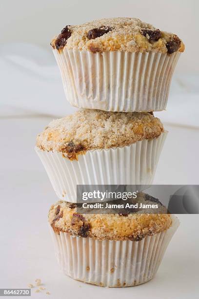 stacked date bran muffins with golden raisins - raisin bran stock pictures, royalty-free photos & images