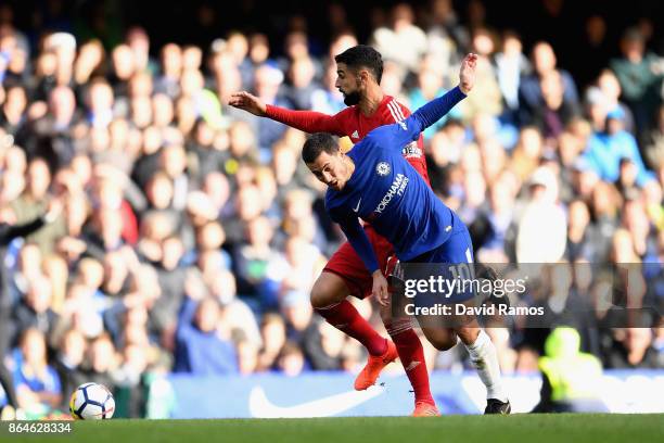Eden Hazard of Chelsea is tackled by Miguel Britos of Watford during the Premier League match between Chelsea and Watford at Stamford Bridge on...