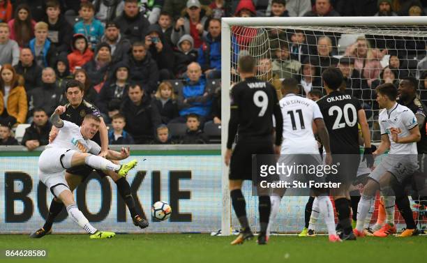 Alfie Mawson of Swansea City scores the 1st Swansea goal during the Premier League match between Swansea City and Leicester City at Liberty Stadium...