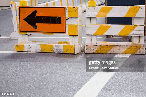 arrow sign at road construction site - detour stock-fotos und bilder