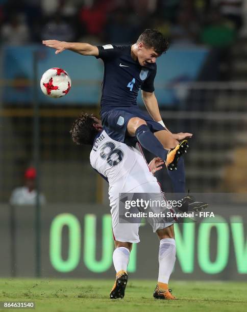 George McEachran of England jumps for a header with Blaine Ferri of the United States during the FIFA U-17 World Cup India 2017 Quarter Final match...