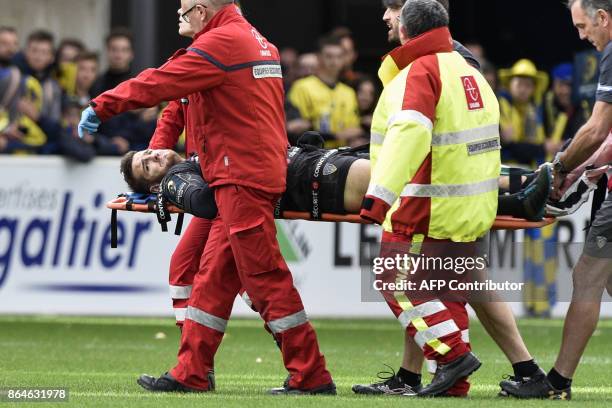 Clermont's French fly-half Camille Lopez is being evacuated on a stretcher after suffering an injury during the European Rugby Champions Cup match...