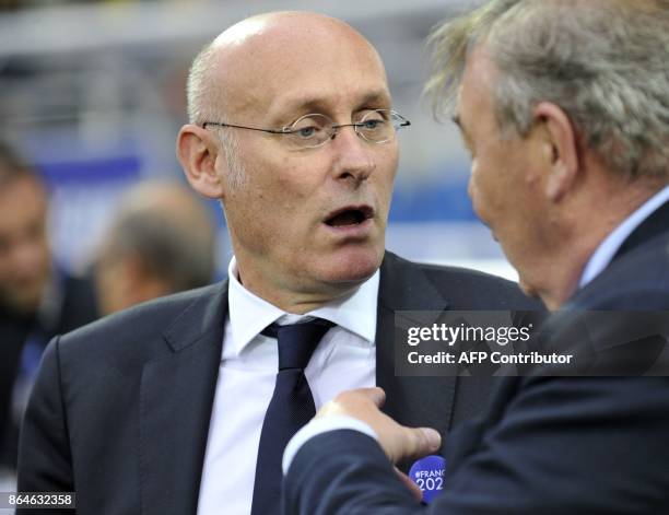 President of the FRench Rugby Federation , Bernard Laporte talks with Clermont's French President Eric De Cromieres during the European Rugby...