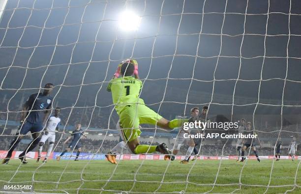 Justin Garces of USA dives to make a save during the quarterfinal football match between USA and England in the FIFA U-17 World Cup at the Jawaharlal...