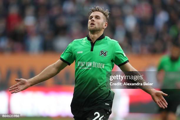 Niclas Fuellkrug of Hannover celebrates after he scored the winning goal for Hannover to make it 1:2 during the Bundesliga match between FC Augsburg...