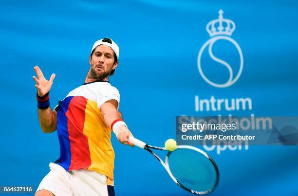 Spain's Fernando Verdasco returns the ball to Argentina's Juan Martin Del Potro during their semi-final tennis match at the ATP Stockholm Open...