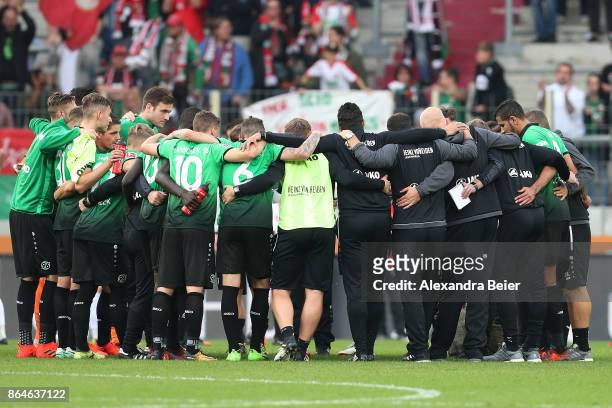 Players of Hannover stand together after the Bundesliga match between FC Augsburg and Hannover 96 at WWK-Arena on October 21, 2017 in Augsburg,...