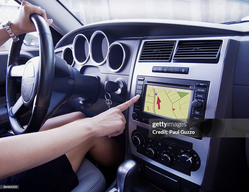 Woman using GPS in car