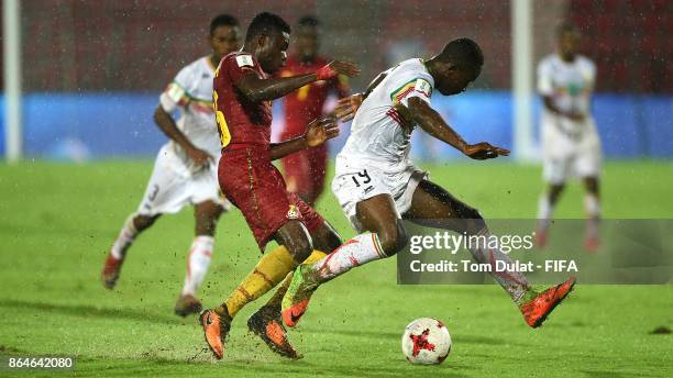 Lassana Ndiaye of Mali and Gideon Mensah of Ghana in action during the FIFA U-17 World Cup India 2017 Quarter Final match between Mali and Ghana at...