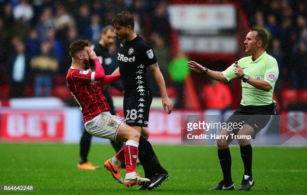 Matt Taylor of Bristol City and Gaetano Berardi of Leeds United clash resulting in red cards for both during the Sky Bet Championship match between...