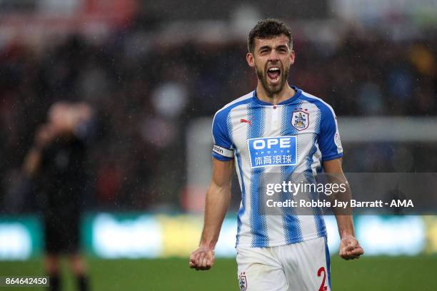 Tommy Smith of Huddersfield Town celebrates at full time during the Premier League match between Huddersfield Town and Manchester United at John...