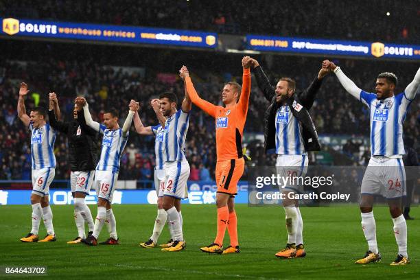 Huddersfield Town players celebrate after winning the Premier League match between Huddersfield Town and Manchester United at John Smith's Stadium on...