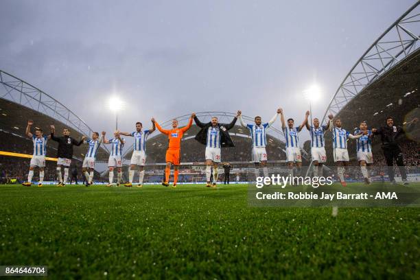 Huddersfield Town players celebrate with the fans at full time during the Premier League match between Huddersfield Town and Manchester United at...