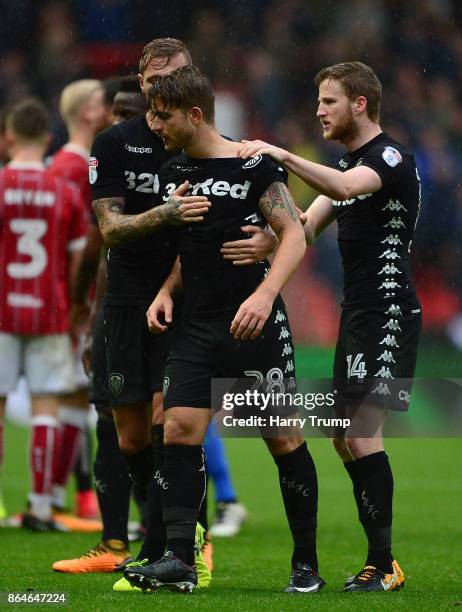 Gaetano Berardi of Leeds United is restrained by team mates after a clash with Matt Taylor of Bristol City resulting in a red card for both during...