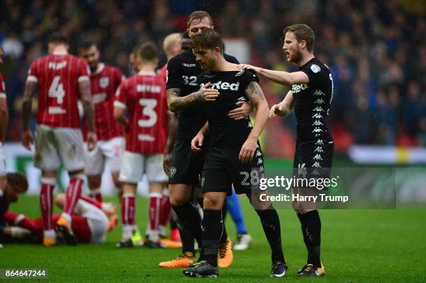 Gaetano Berardi of Leeds United is restrained by team mates after a clash with Matt Taylor of Bristol City resulting in a red card for both during...