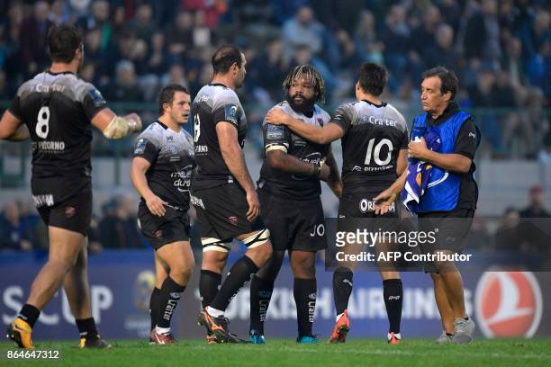 Toulon's French fly-half Francois Trinh-Duc is congratulated by RC Toulon's French centre Mathieu Bastareaud after kicking a penalty to win the match...