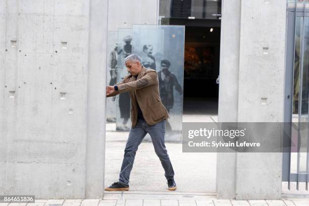 Sami Bouajila attends the shooting of French short black-and-white silent documentary film 'La Sortie de l'Usine' directed by Wong Kar-wai at the...