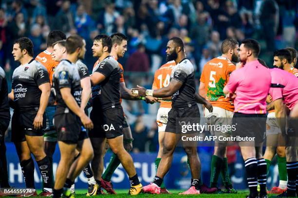 Toulon's Fijian-Australian centre Semi Radradra shakes hand with Treviso players after the European Rugby Champions Cup match Benetton Treviso vs RC...