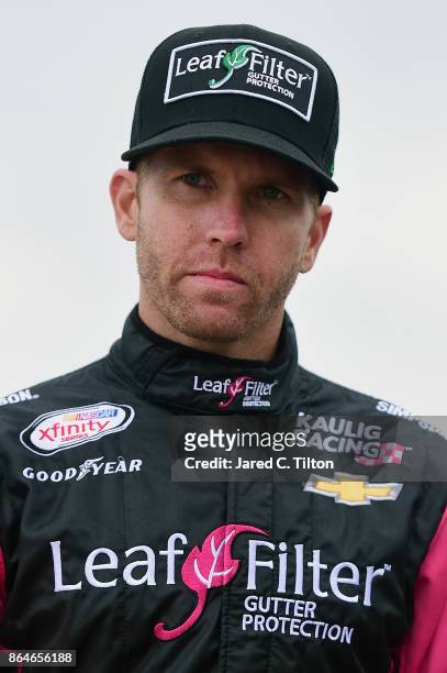 Blake Koch, driver of the Breat Cancer Honor & Remember Chevrolet, stands on the grid during qualifying for the NASCAR XFINITY Series Kansas Lottery...
