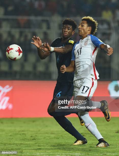 Player Bryan Reynolds vies with England's Jonathan Panzo during the quarter-final football match between USA and England in the FIFA U-17 World Cup...
