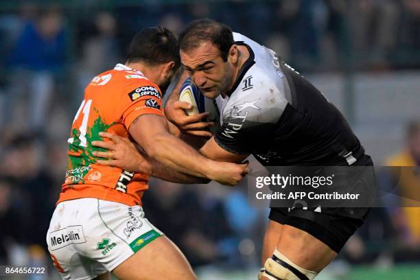 Toulon's Georgian flanker Mamuka Gorgodze vies with Benetton Treviso's Italian scrumhalf Tito Tebaldi during the European Rugby Champions Cup rugby...