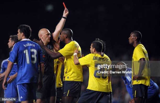 Samuel Eto'o of Barcelona and his team mates argue with referee Tom Henning Ovrebo after Eric Abidal of Barcelona received a red card during the UEFA...